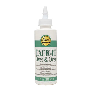 Bottle of Aleene's Tack-It over and over glue