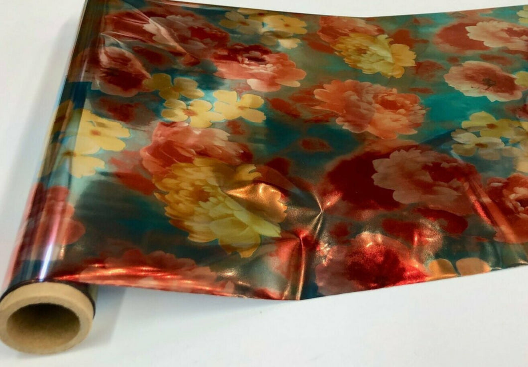 Roll of hot press foil aqua blue background with red and yellow flower pattern. Can be used for multiple craft projects.