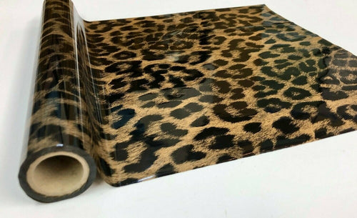 Roll of hot press foil with gold hair like background and black cheetah spot pattern. Can be used for multiple craft projects.