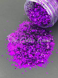 pink to purple color shifting chunky cut glitter in a bottle