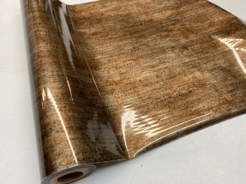 Roll of hot press foil with indian bronze color and patina pattern. Can be used for multiple craft projects.