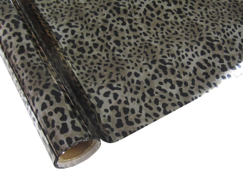 Roll of hot press foil with silver color background and black leopard spot pattern. Can be used for multiple craft projects.