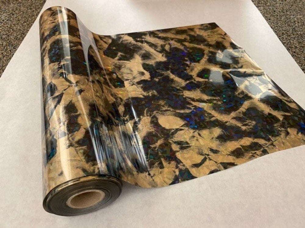 Roll of hot press foil with gold color background and black marble hologram cracked ice pattern. Can be used for multiple craft projects.