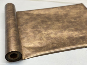 Roll of hot press foil with gold nevada sun color background and patina pattern. Can be used for multiple craft projects.