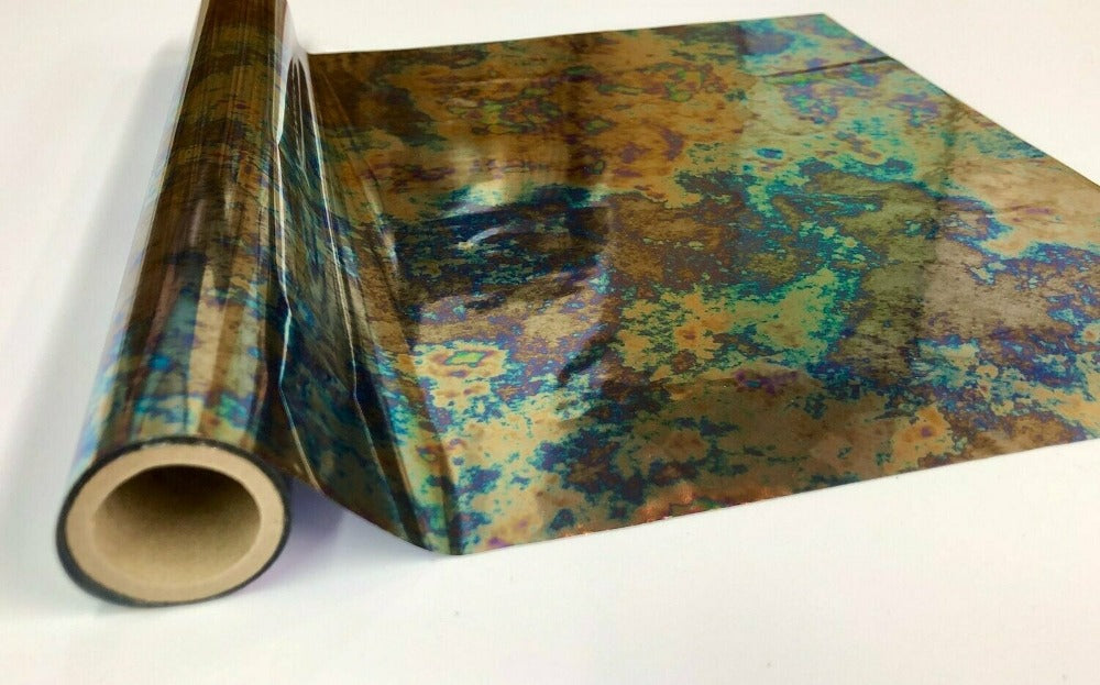Roll of hot press foil with gold bronze blue and green patina pattern. Can be used for multiple craft projects.