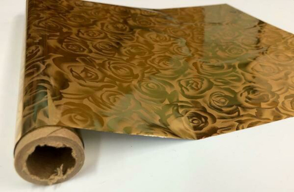 Roll of hot press foil with rose gold background and gold rose pattern. Can be used for multiple craft projects.