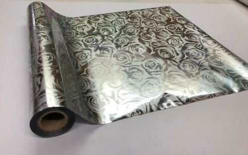 Roll of hot press foil with silver color background and silver rose pattern. Can be used for multiple craft projects.