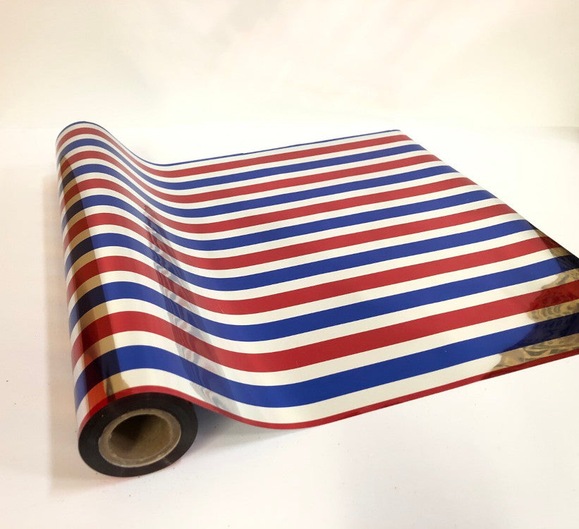 Roll of hot press foil with blue red and silver stripe pattern. Can be used for multiple craft projects.